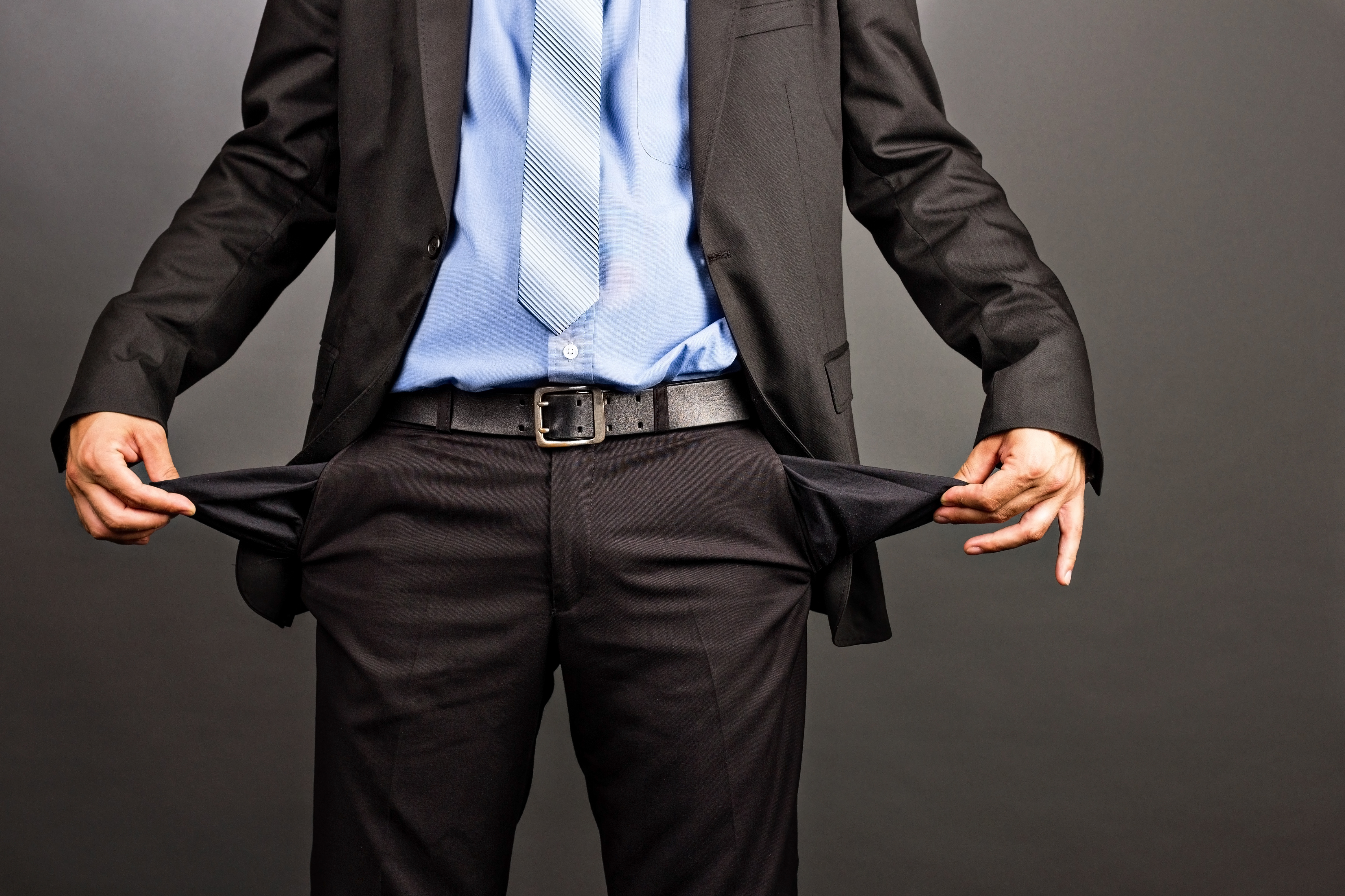 PHC0622_businessman-showing-empty-pockets.jpg