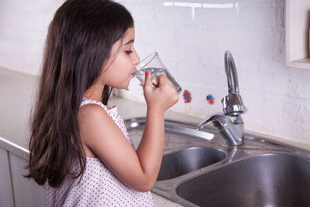 PE0724_little girl drinking water at kitchen faucet.jpg