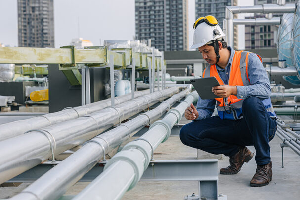 PE0824_engineer checking water pipe.jpg